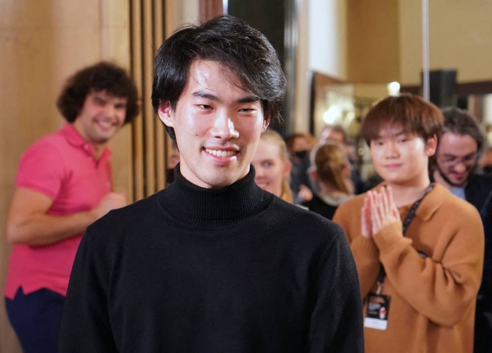 The winner the 18th Chopin competition Canada's Bruce Xiaoyu Liu smiles after the results were announced in Warsaw on October 21, 2021. AFP PHOTO