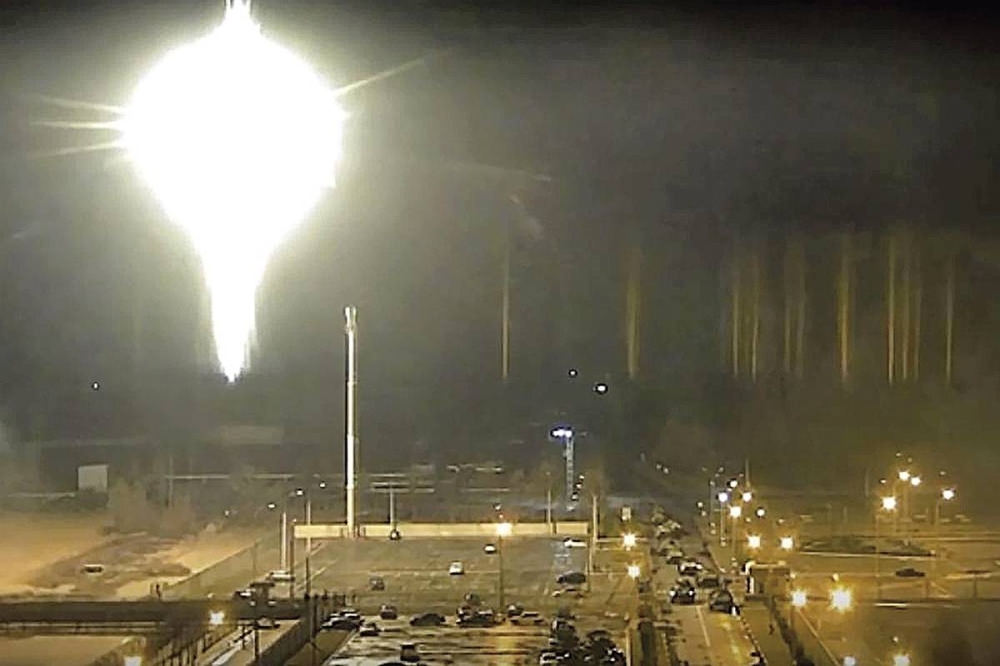 UNDER ATTACK This image made from a video released by Zaporizhzhia nuclear power plant shows a bright flaring object landing in the grounds of the nuclear plant in Enerhodar, Ukraine on Friday, March 4, 2022. Russian forces shelled Europe’s largest nuclear plant early Friday, sparking a fire as they pressed their attack on a crucial energy-producing Ukrainian city and gained ground in their bid to cut off the country from the sea. AP PHOTO