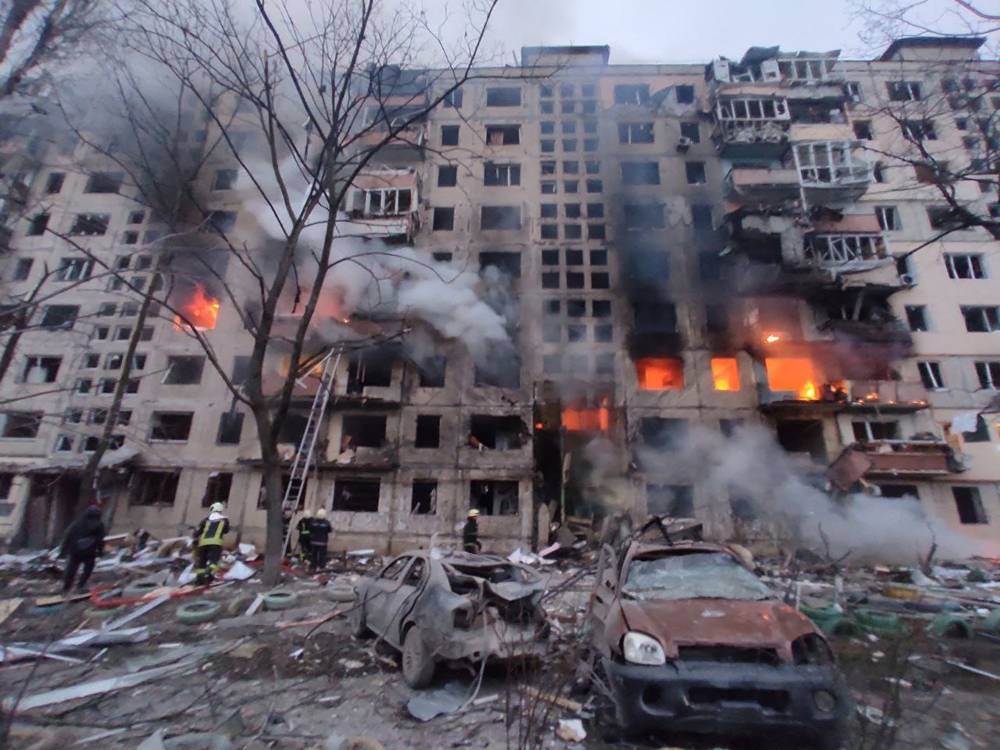 In this handout picture taken and released by the State Emergency Service of Ukraine on March 14, 2022, firemen work to extinguish a fire in an apartment building hit by shelling in the Obolon district of Kyiv. AFP PHOTO / State Emergency Service of Ukraine / handout