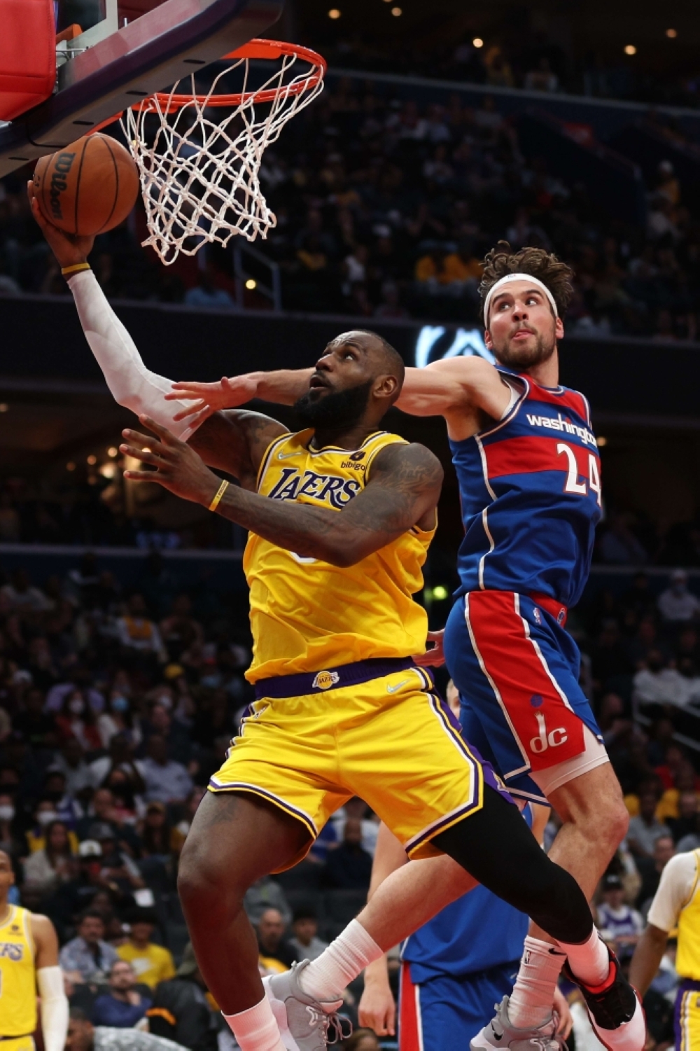 LeBron James of the Los Angeles Lakers gets past Corey Kispert of the Washington Wizards during the second half at Capital One Arena on Saturday, March 19, 2022 (March 20 in Manila) in Washington, DC. AFP PHOTO