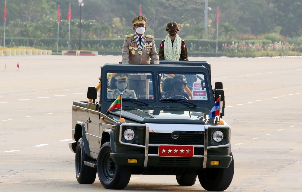 BRUTAL RULE Myanmar’s Chief Senior General Min Aung Hlaing (left) attends a ceremony to mark the country’s 77th Armed Forces Day in Naypyidaw on Sunday, March 27, 2022. AFP PHOTO