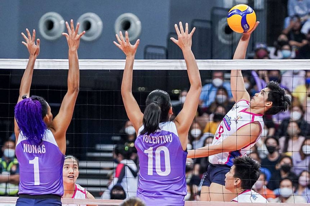 Creamline’s Tots Carlos attacks against Choco Mucho blockers Cherry Nunag and Kat Tolentino during the remier Volleyball League (PVL) Open Conference on Sunday at the Mall of Asia Arena. CONTRIBUTED PHOTO