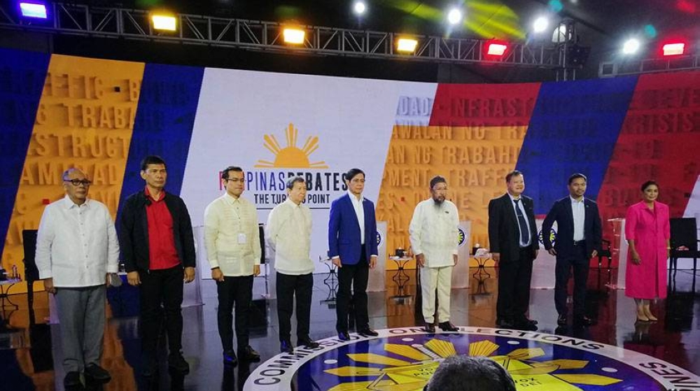 Presidential candidates pose before the start of the second debate sponsored by the Commission on Elections held at the Sofitel Harbor Garden Tent in Pasay City on Sunday, April 3, 2022. From left are Ernesto Abella, Leodegario de Guzman, Francisco Domagoso, Norberto Gonzales, Panfilo Lacson, Faisal Mangondato, Jose Montemayor, Emmanuel Pacquiao and Maria Leonor Robredo. PHOTO BY J. GERARD SEGUIA
