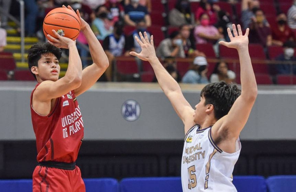 University of the Philippines’ Ricci Rivero goes for a jumper against National University’s Enzo Joson during the UAAP Season 84 men’s basketball tournament at the Mall of Asia Arena in Pasay City on Tuesday, April 12, 2022. UAAP PHOTO