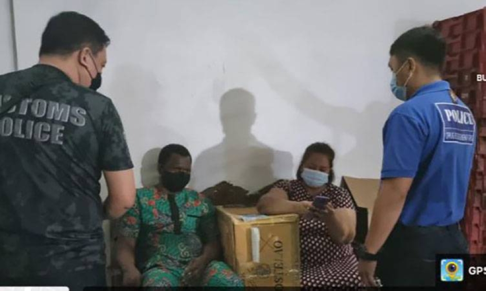 NABBED AT NAIA
A foreigner, identified as a Nigerian, and a Filipina are arrested at the Ninoy Aquino International Airport on Thursday, April 28, 2022, after receiving a package with 588 grams of shabu during controlled delivery operations. PHOTO BY BOC-NAIA