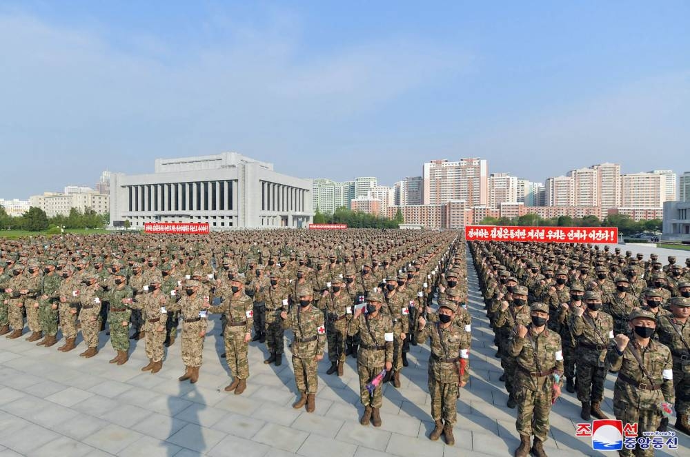 This picture taken on May 16, 2022 and released from North Korea's official Korean Central News Agency  on May 17 shows a rally of the military medical field of the Korean People's Army and the Ministry of Defense to control the epidemic crisis, in Pyongyang. AFP PHOTO/KCNA VIA KNS