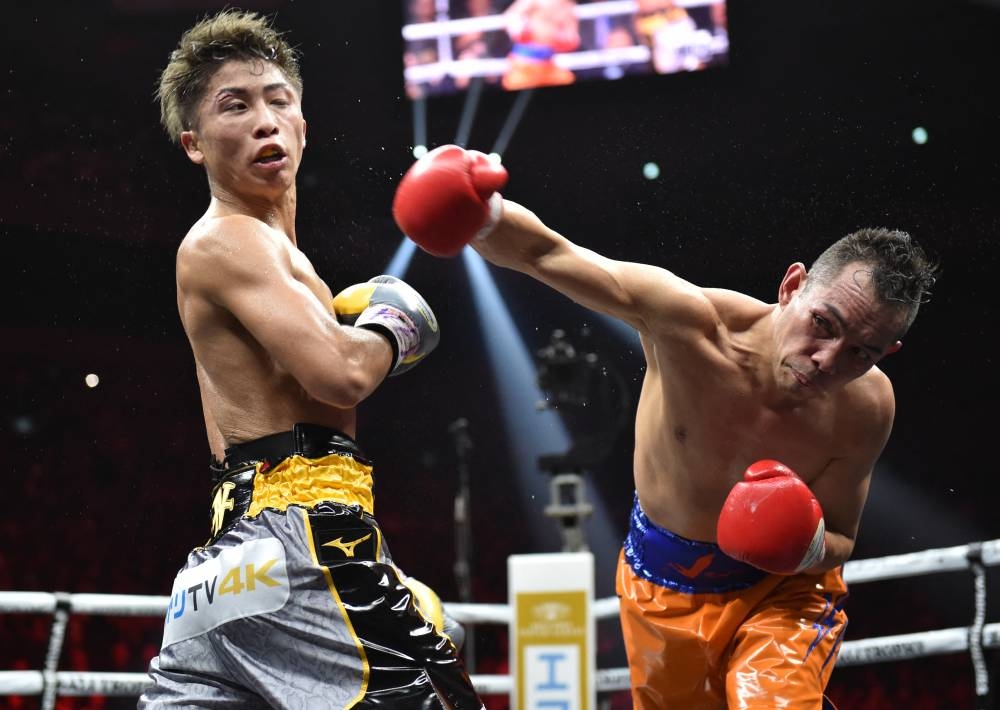 In this file photo taken on November 7, 2019, Philippines' Nonito Donaire (right) and Japan's Naoya Inoue fight in their World Boxing Super Series bantamweight final at Saitama Super Arena in Saitama. AFP PHOTO