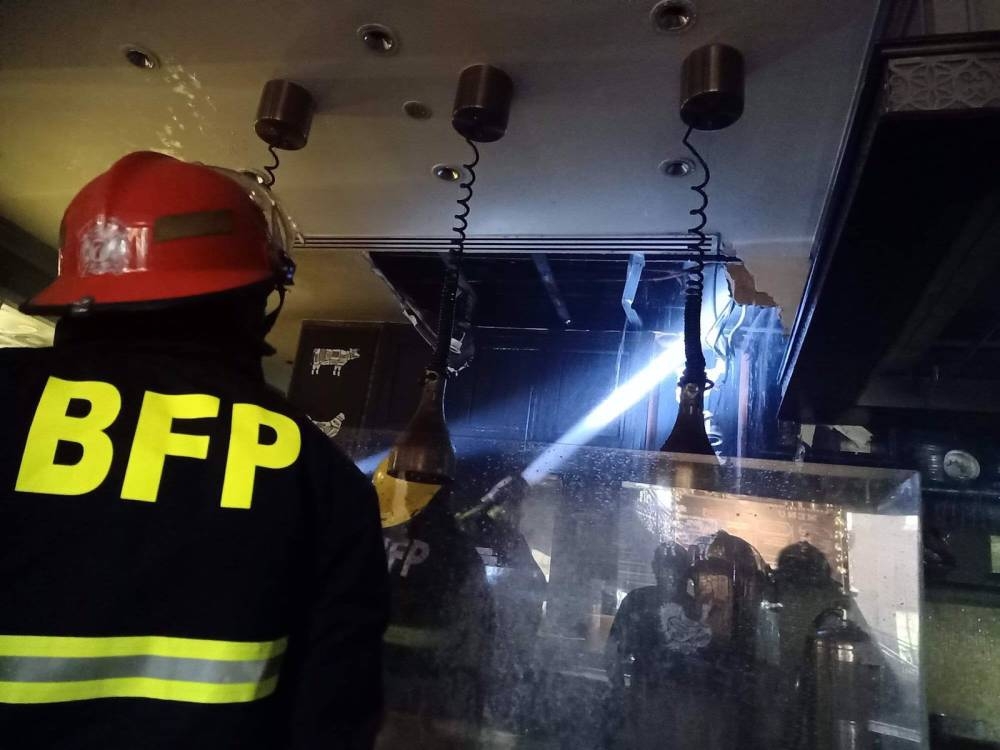 Firemen put out the blaze at the sofitel ph plaza. PHOTO COURTESY OF PASAY CITY FIRE DEPARTMENT 