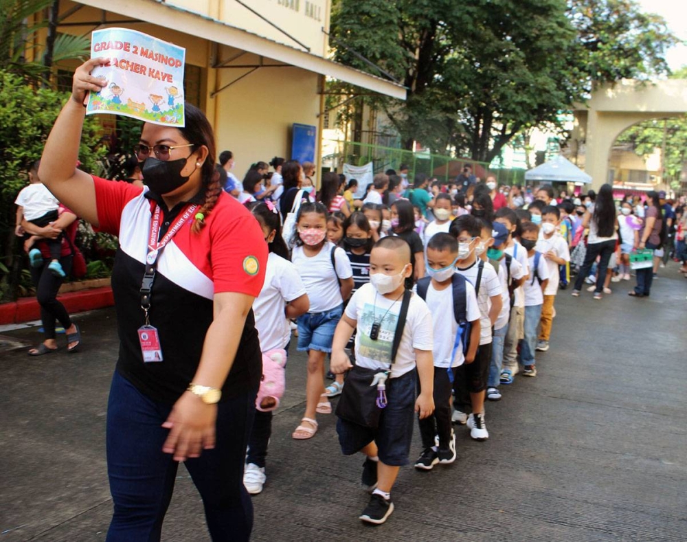 Grade 2 pupils of the Quirino Elementary School walk to their classroom during a dry-run of face-to-face classes on Tuesday, Aug. 16, 2022. Schools will open on August 22. PHOTO BY MIKE DE JUAN