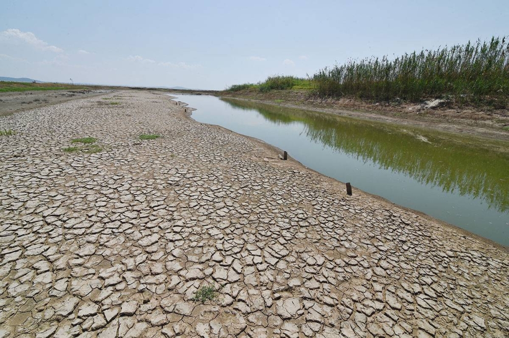 This photo taken on August 21, 2022 shows dry sections of a lake in Nanjing in China's eastern Jiangsu province. (Photo by AFP) / China OUT