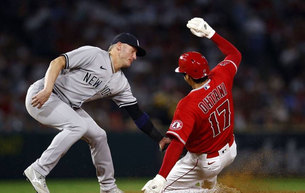 Shohei Ohtani of the Los Angeles Angels (right) is caught stealing second against Josh Donaldson of the New York Yankees in the sixth inning at Angel Stadium of Anaheim on Tuesday, Aug. 30, 2022 (August 31 in Manila), in Anaheim, California. AP PHOTO