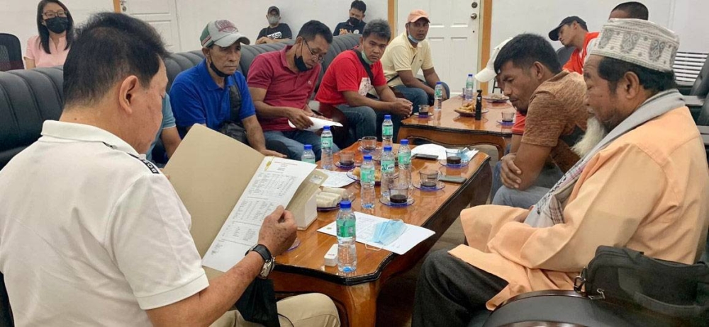 A provincial government photo shows Sulu Gov. Sakur Tan reading a report by the Federation of Sulu Coffee Producers Cooperative. Sulu’s Arabica and Robusta, popularly known as ‘Kahawa Sug’ is now being exported to Japan. CONTRIBUTED PHOTO