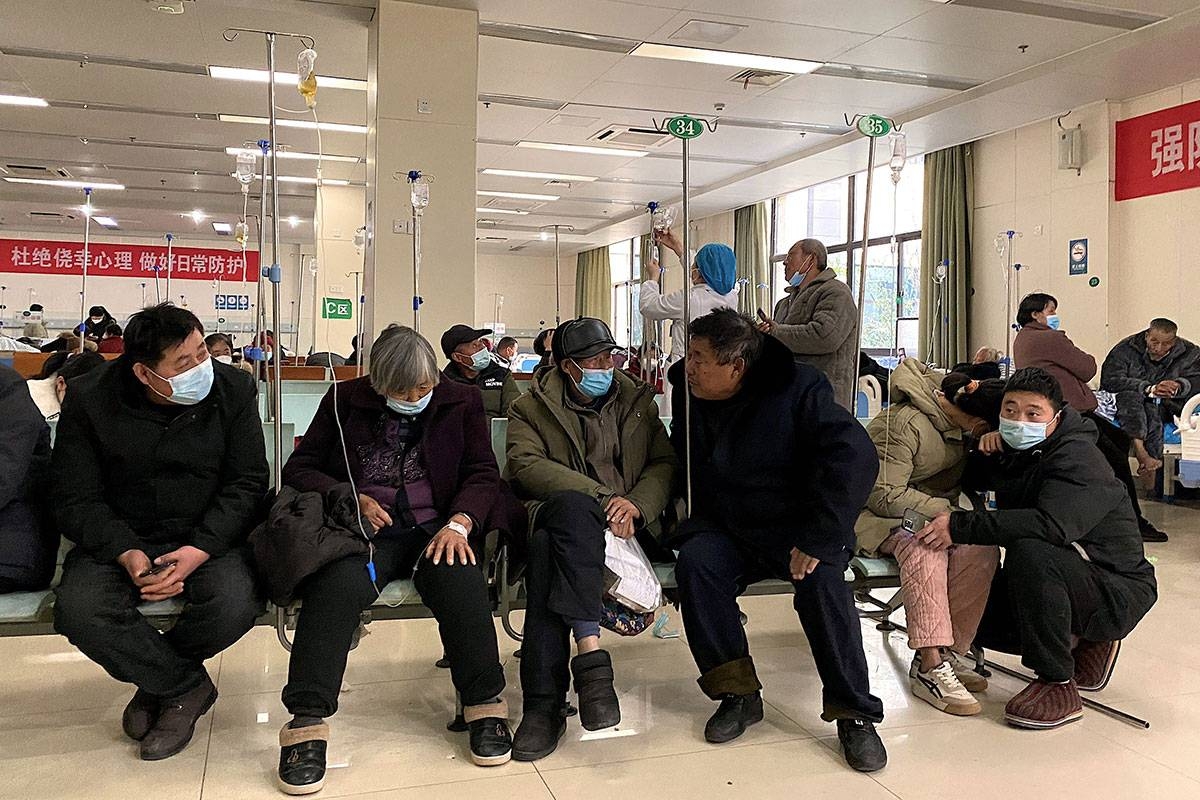 Patients with Covid-19 coronavirus rest in a hallway at Fengyang People's Hospital in Fengyang County in east China's Anhui Province on January 5, 2023. Noel Celis / AFP