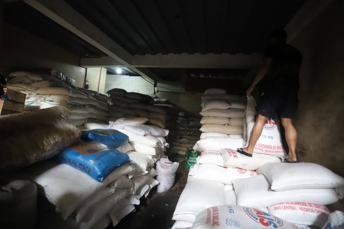 Worker stores sacks of sugar at retail store in Marikina | The Manila Times