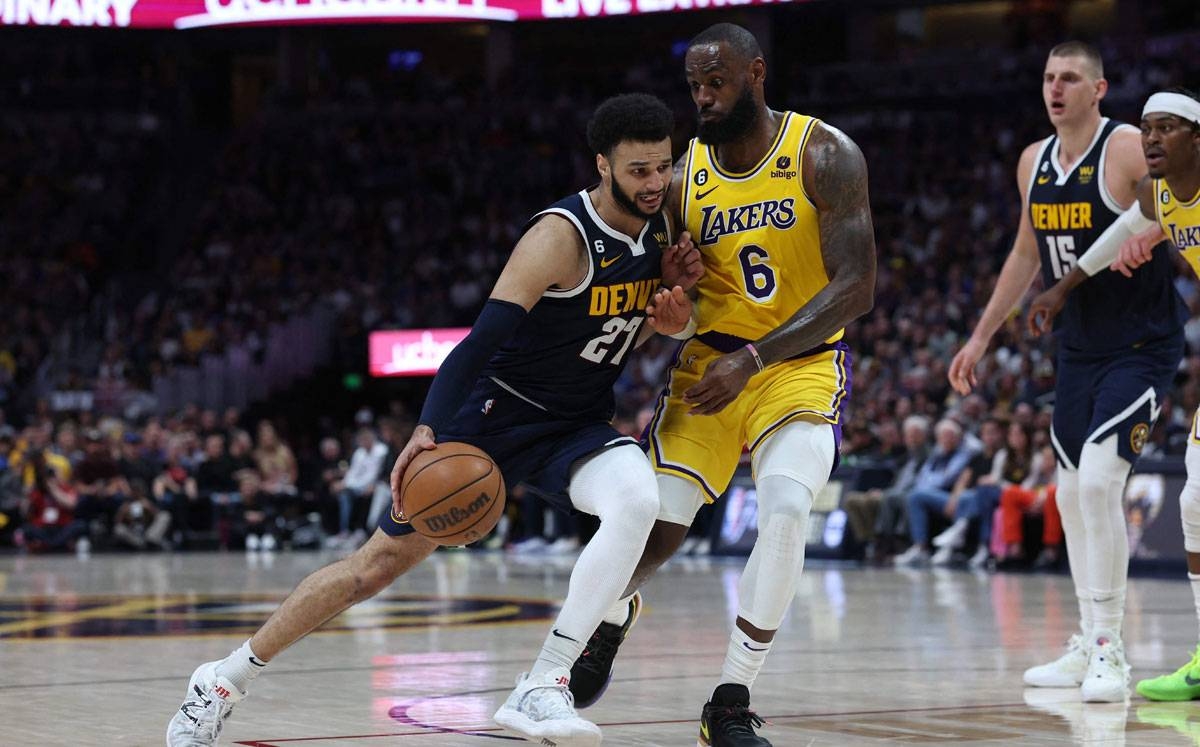AMAZING Jamal Murray of the Denver Nuggets drives against LeBron James of the Los Angeles Lakers during the third quarter in Game 2 of the Western Conference Finals at Ball Arena on Thursday, May 18, 2023, in Denver, Colorado. PHOTO BY MATTHEW STOCKMAN/AFP