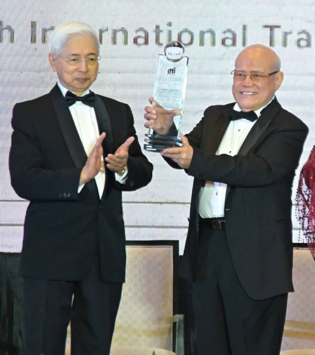 Department of Trade and Industry Secretary Fred Pascual handing over CITEM's symbol of leadership to Executive Director Dr. Edward Fereira Ph.D.