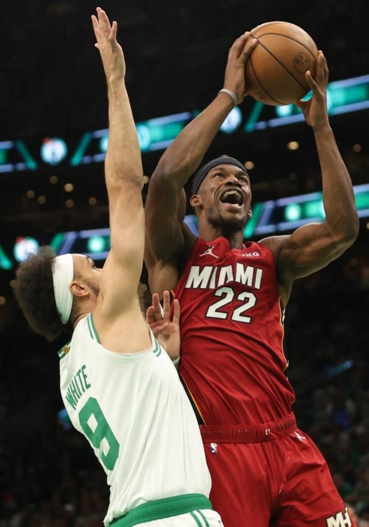 Jimmy Butler (right) of the Miami Heat drives to the basket againstDerrick White of the Boston Celtics during the first quarter in Game 2 of theEastern Conference Finals at TD Garden on Friday, May 19, 2023, in Boston,Massachusetts. AFP PHOTO