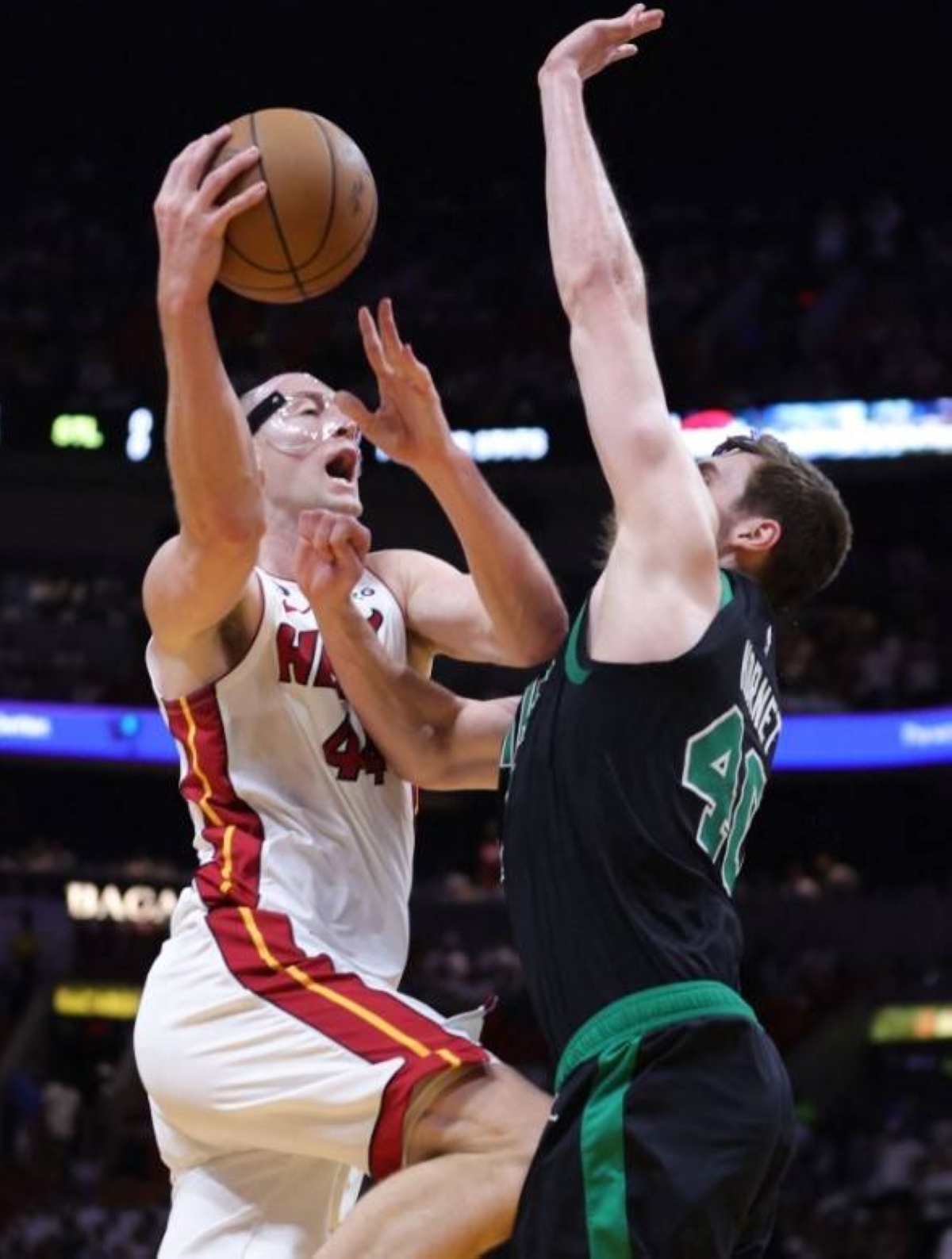 Cody Zeller of the Miami Heat drives to the basket against Luke Kornet of the Boston Celtics during the fourth quarter in Game 3 of the Eastern Conference Finals at Kaseya Center on Sunday, May 21, 2023, in Miami, Florida. AFP PHOTO