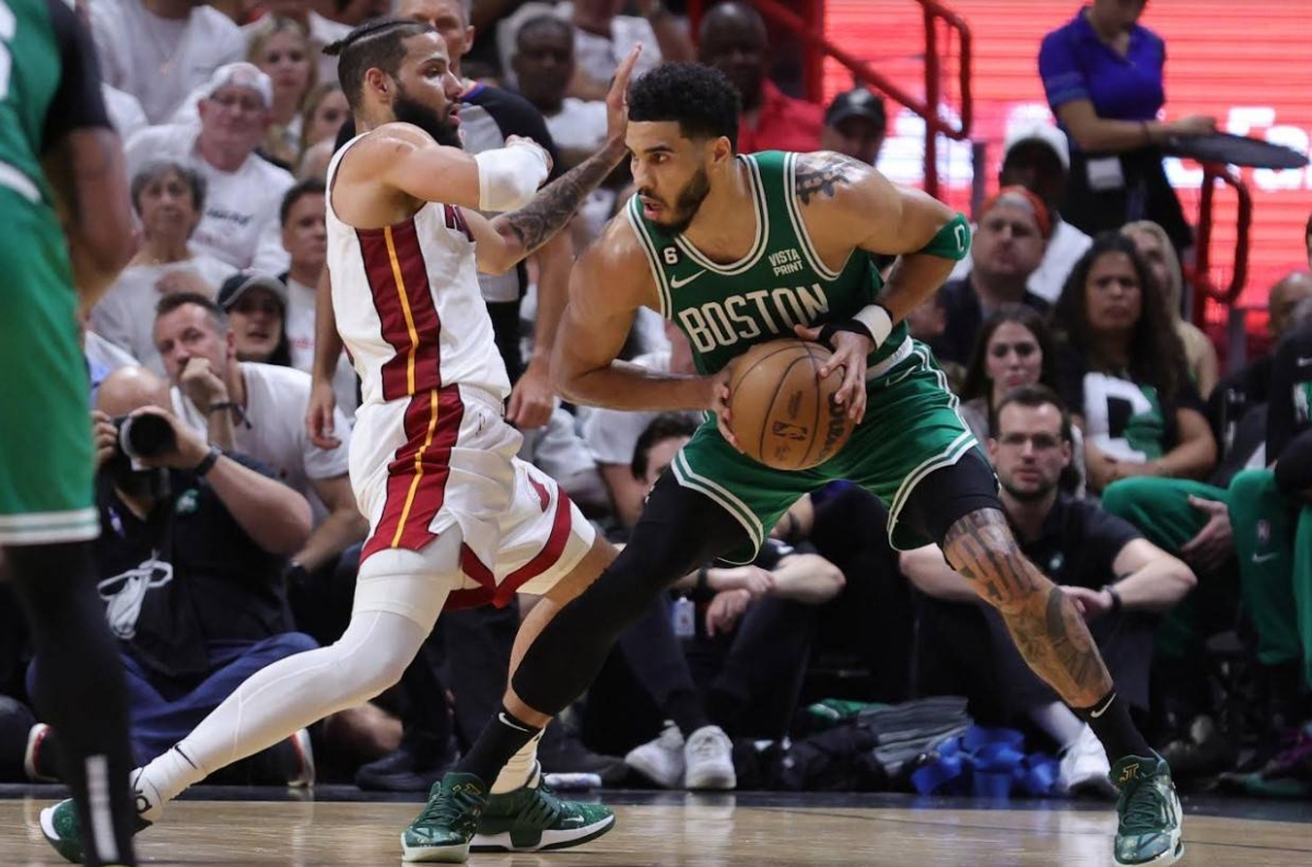 Jayson Tatum of the Boston Celtics drives against Caleb Martin of the Miami Heat during the third quarter in game four of the Eastern Conference Finals at Kaseya Center on May 23, 2023 in Miami, Florida. AFP PHOTO