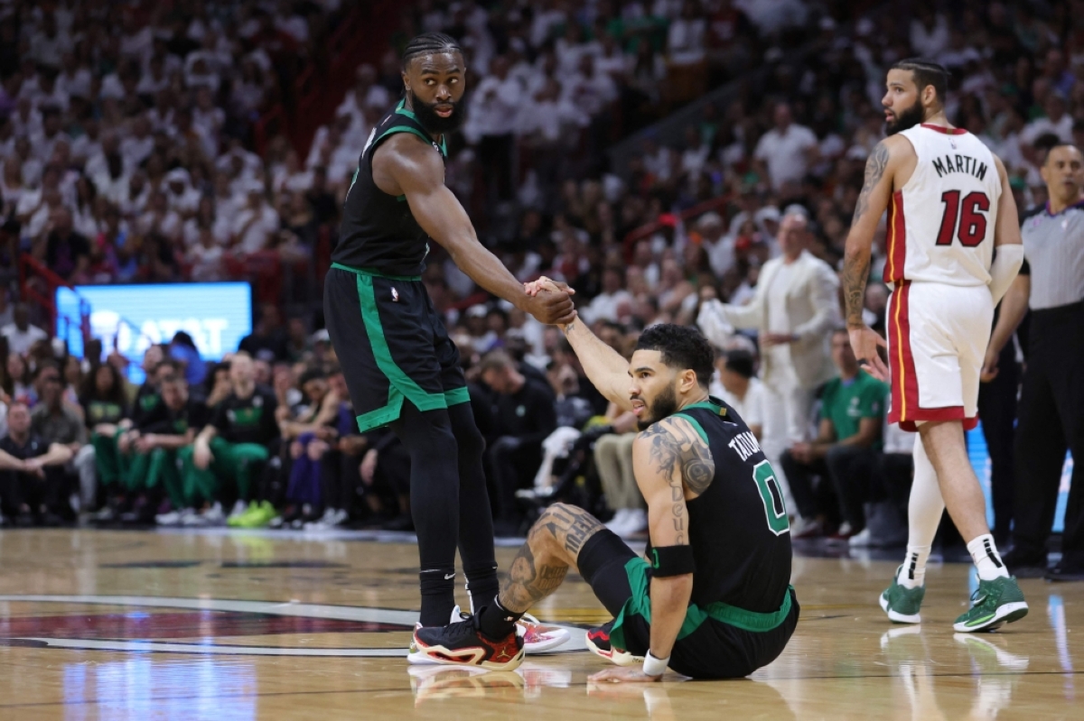 STAND UP Jaylen Brown of the Boston Celtics helps up Jayson Tatum during the first quarter against the Miami Heat in Game 3 of the Eastern Conference Finals at Kaseya Center on Monday, May 22, 2023, in Miami, Florida. PHOTO BY MEGAN BRIGGS/AFP