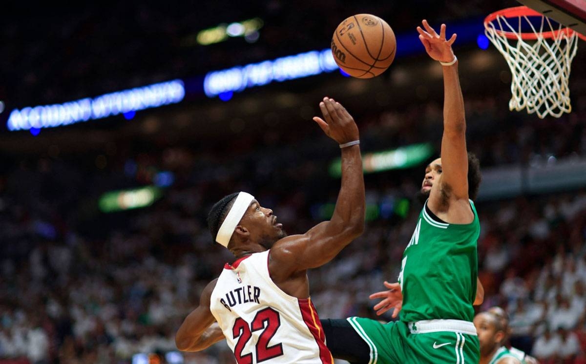 Jimmy Butler of the Miami Heat battles Derrick White of the Boston Celtics during the third quarter in Game 6 of the Eastern Conference Finals at Kaseya Center on Saturday, May 27, 2023, in Miami, Florida. AFP PHOTO