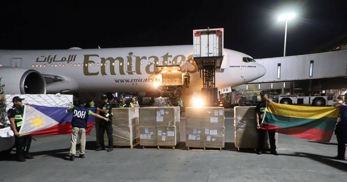 Airline personnel unload the shipment of donated bivalent vaccines. Contributed photo