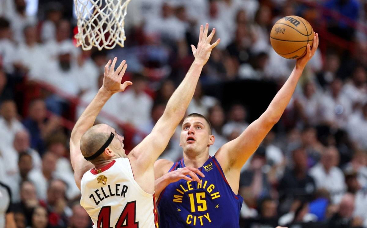 INDOMITABLE Nikola Jokic of the Denver Nuggets drives to the basket against Cody Zeller of the Miami Heat during the second quarter in Game 3 of the 2023 NBA Finals at Kaseya Center on Wednesday, June 7, in Miami, Florida. PHOTO BY MIKE EHRMANN/AFP