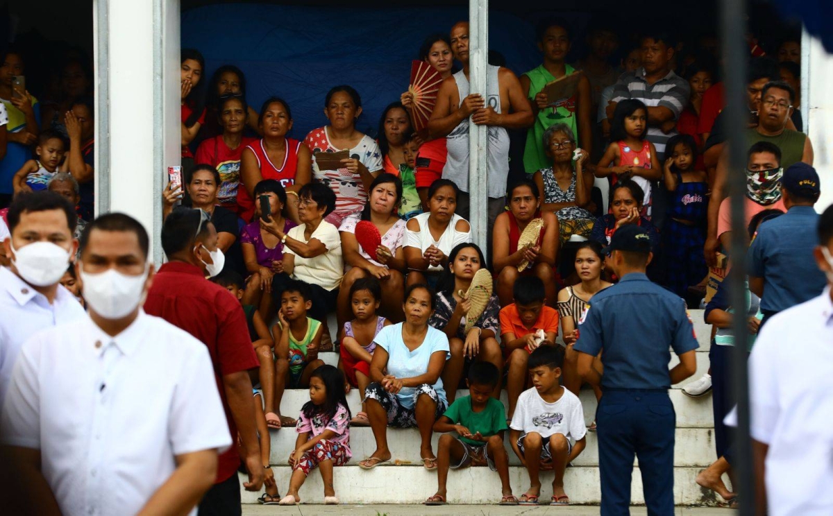 President Ferdinand Marcos Jr., Interior and Local Government Secretary Benhur Abalos Jr, Defense Secretary Gilbert Teodoro, Social Welfare Secretary Rex Gatchalian, Science and Technology Secretary Renato Solidum Jr. and Albay Governor Edcel Greco Lagman visit and distribute relief goods to Mayon  evacuees at the Guinobatan Community College evacuation center on Wednesday, June 14, 2023. PHOTO BY MIKE ALQUINTO