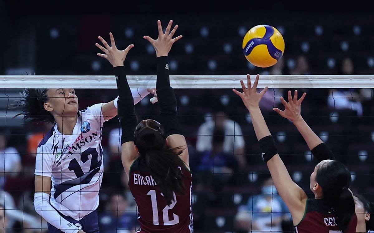 Adamson's Trisha Tubu goes for an attack against two University of the Philippines defenders during the UAAP Season 85 women's volleyball tournament. PHOTO BY RIO DELUVIO