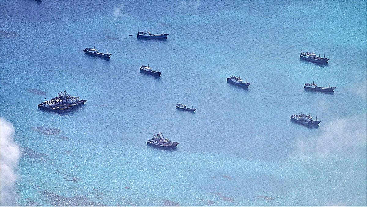 LIKE BEES TO HONEY This photo shows Chinese fishing vessels swarming off the Iroquois Reef and Sabina Shoal, south of the oil- and gas-rich Recto Bank in the West Philippine Sea. This was taken from an air patrol by the Armed Forces of the Philippines (AFP) on June 30, 2023. PHOTO COURTESY OF THE WESTERN COMMAND OF THE AFP