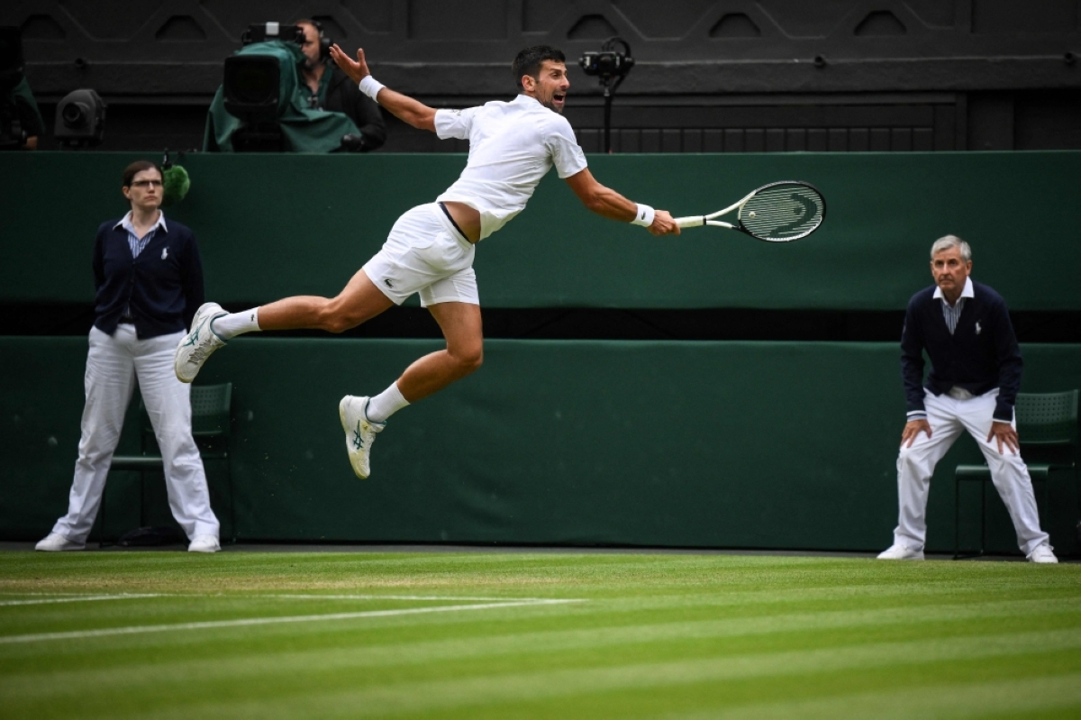 IN HIGH GEAR Serbia’s Novak Djokovic jumps to return the ball to Russia’s Andrey Rublev during their men’s singles quarterfinals tennis match on the ninth day of the 2023 Wimbledon Championships at The All England Tennis Club in Wimbledon, southwest London, on Tuesday, July 11, 2023. PHOTO BY DANIEL LEAL/AFP