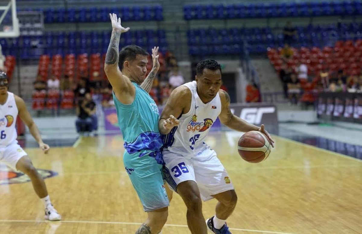 Ping Exciminiano of TNT makes his move against RR Garcia of Phoenix during their PBA on Tour game on Wednesday, July 19. PBA IMAGE