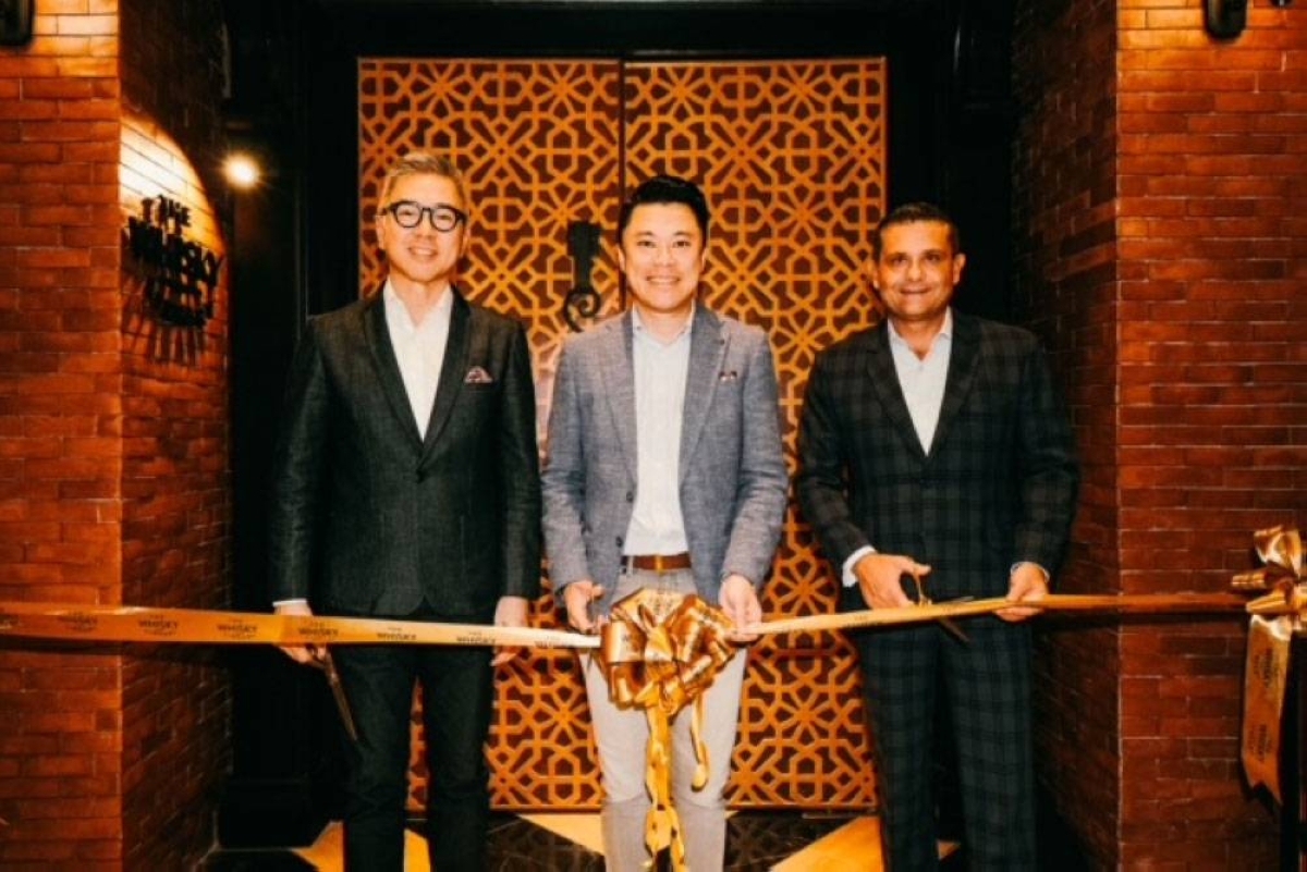 Alliance Global Group Inc., parent company of Megaworld Corporation, CEO Kevin Tan (center) with The Whisky Library CEO and president Kingson Sian (left) and chief marketing officer David Jorden lead the opening.