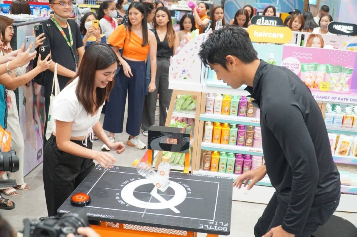 Pangilinan played Bottle Flip with a lucky shopper at Watsons Store North Edsa.