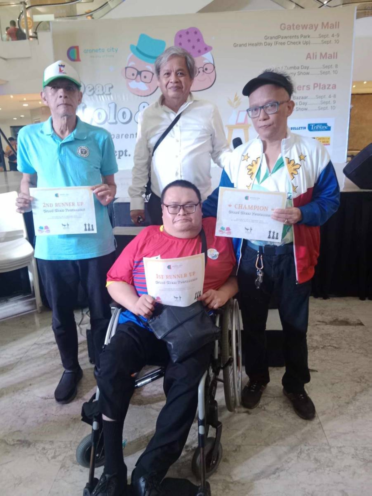 Standing from left are third placer International Master Jose Efren Bagamasbad, National Chess Federation of the Philippines director and tournament organizer Martin 