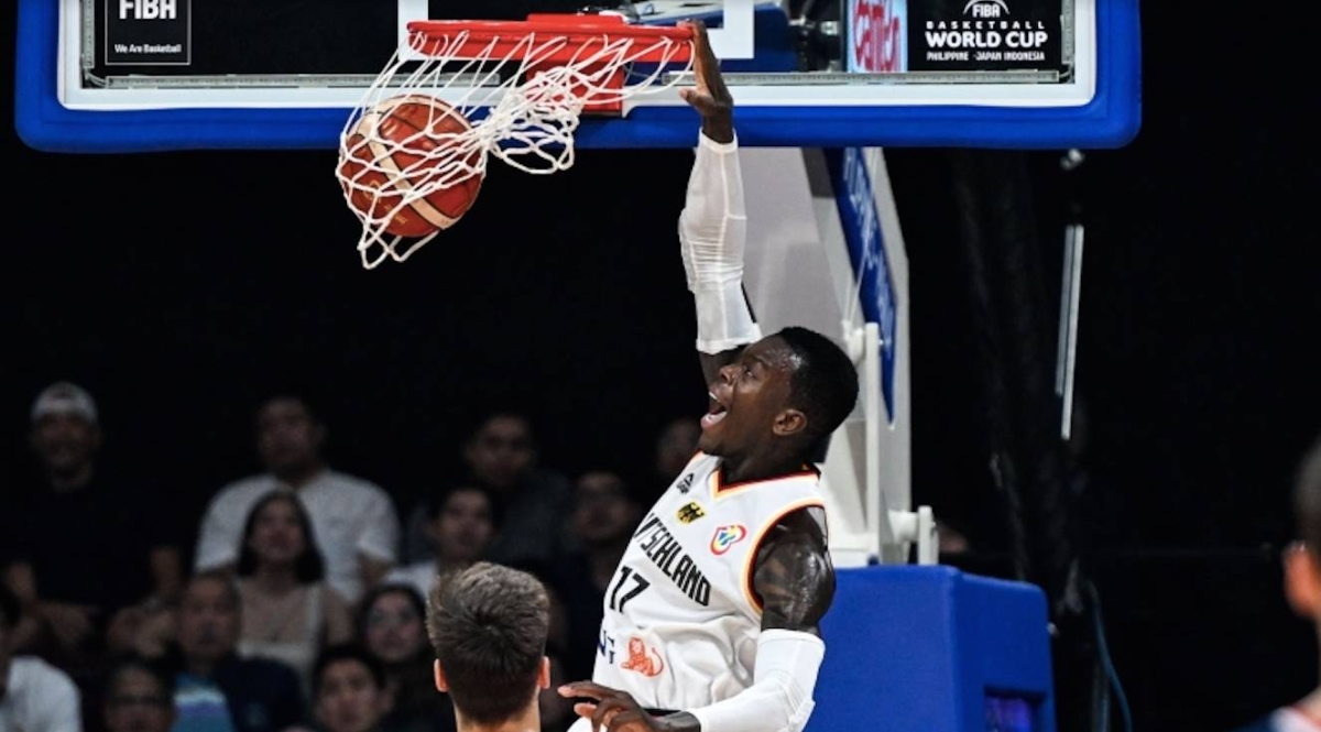 Germany's Dennis Schroder dunks the ball during the FIBA Basketball World Cup final game between Germany and Serbia in Manila on September 10, 2023. AFP PHOTO