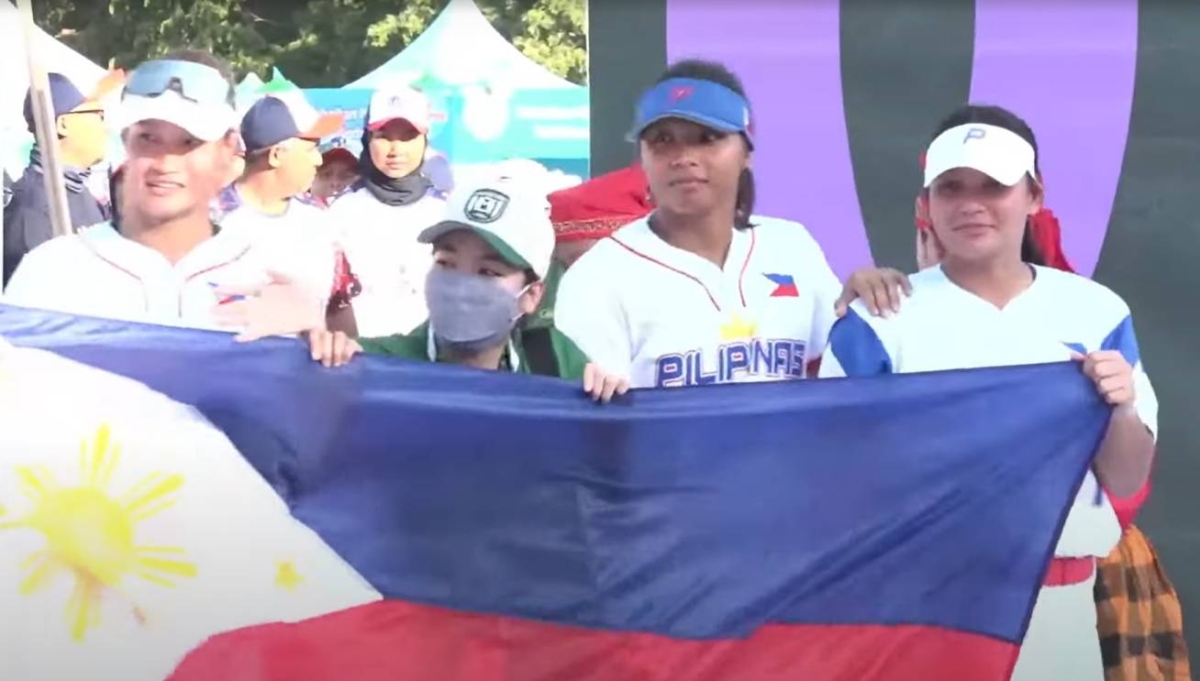 The Blu Girls carry the Philippine flag during the opening ceremony of the 2023 Makassar Open International Softball Tournament in Indonesia. SCREEN GRAB FROM MAKASSAR OPEN LIVE STREAM