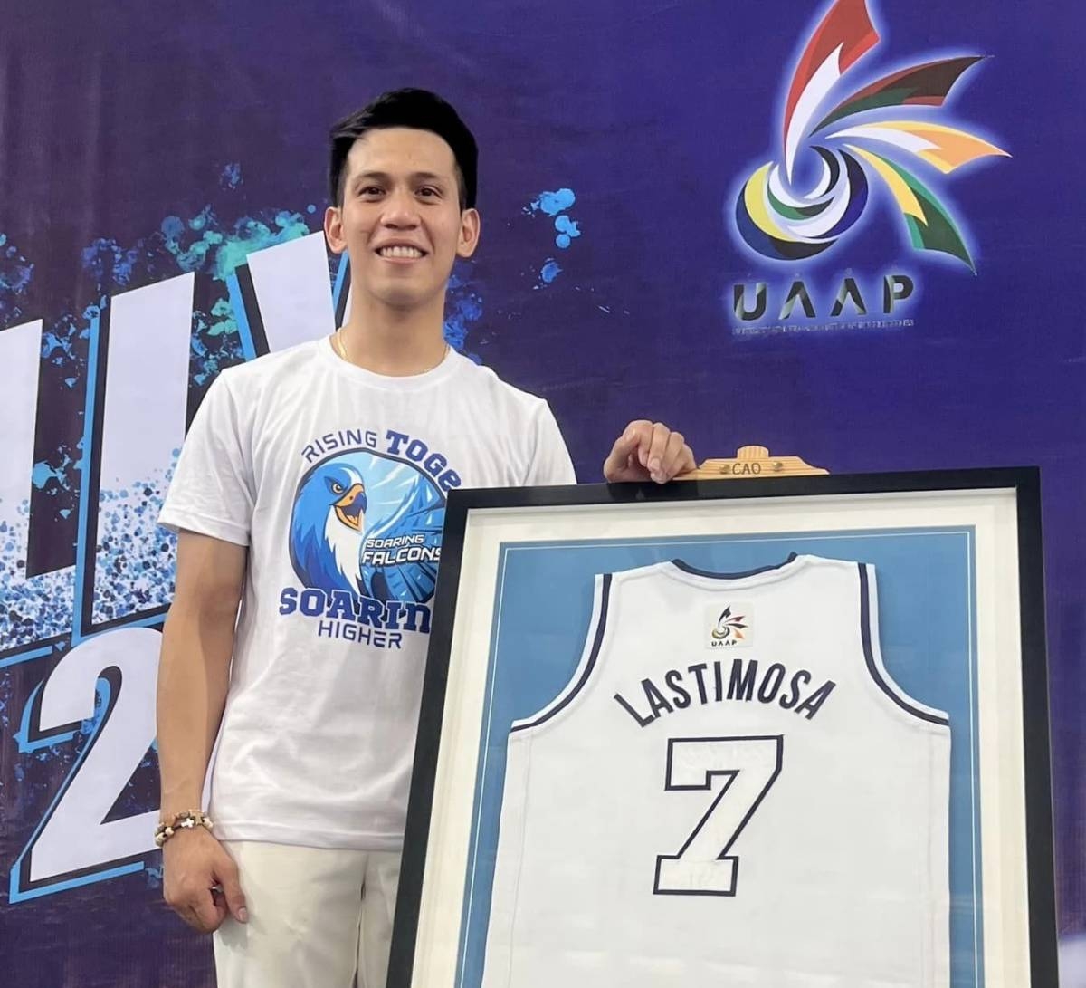 Adamson Falcons point guard Jerom Lastimosa with his retired jersey number 7 in a ceremony on Friday, Sept. 29, 2023. PHOTO FROM ADAMSON UNIVERSITY
