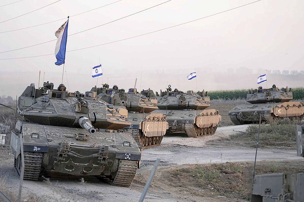 THE RUMBLING Israeli tanks head toward the Gaza Strip border in Southern Israel on Thursday, Oct. 12, 2023. Israel’s military told some 1 million Palestinians on Friday, October 13, to evacuate northern Gaza and head to the southern part of the besieged territory, an unprecedented order applying to almost half the population ahead of an expected ground invasion against the ruling Hamas militant group. PHOTO BY AP