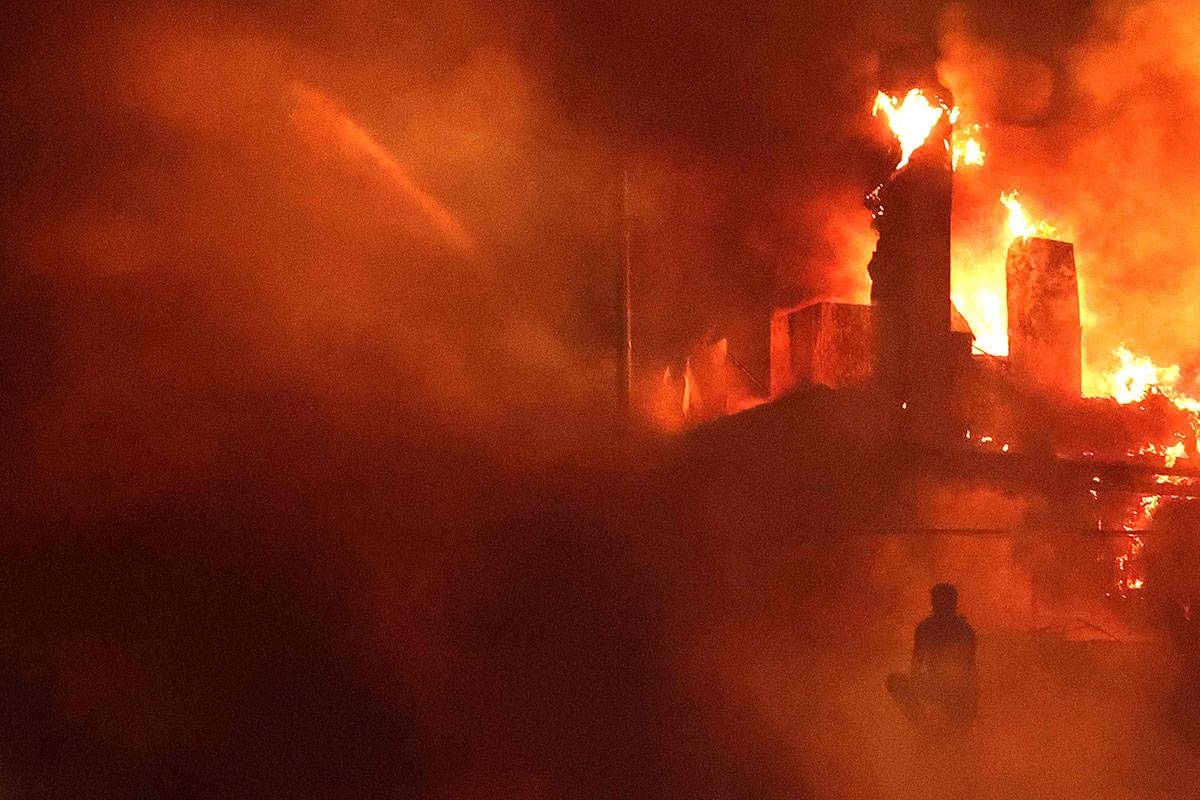 Fiery day A Lebanese protester sits outside the US Embassy as a fire rages behind its gates after clashes with Lebanese security forces on Wednesday, Oct. 18, 2023, during a demonstration in solidarity with the people of Gaza in Awkar, East of Beirut, following a blast ripped through a hospital in the Gaza Strip, killing at least 200 people on October 17. AFP photo