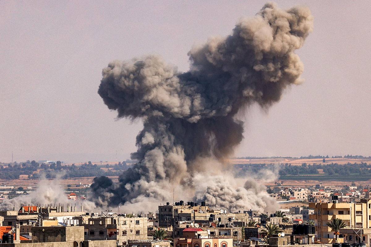 A smoke plume erupts during Israeli bombardment in Rafah in the southern of Gaza Strip on October 19, 2023. SAID KHATIB / AFP