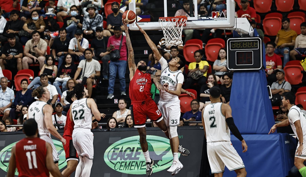 FAVORED TO WINBarangay Ginebra import Tony Bishop, seen here shooting over the outstretched arm Kemark Carino of Terrafirma, will try to lead the Gin Kings to their fifth win in seven games when they clash against the San Miguel Beermen in PBA Commissioner’s Cup on Friday, Dec.15, 2023, at the Smart Araneta Coliseum in Quezon City. PBA IMAGE