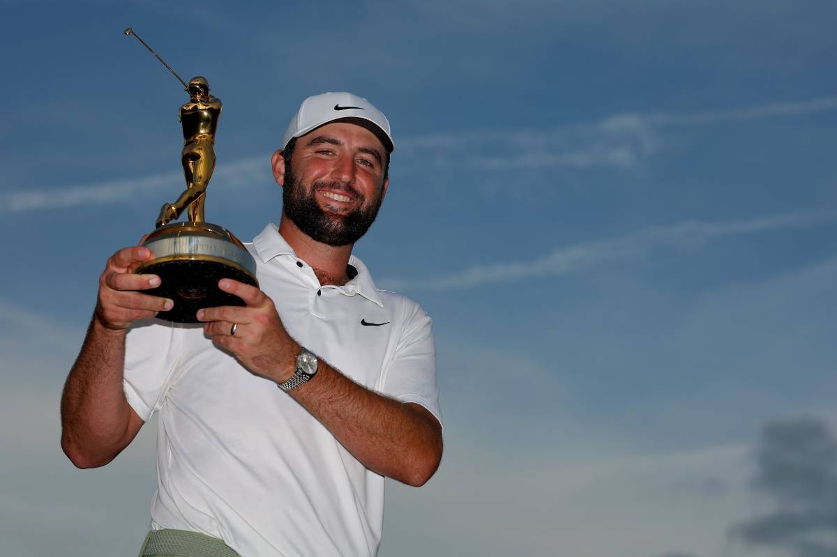 NUMBER ONE Scottie Scheffler of the United States poses with the trophy after winning The Players Championship at TPC Sawgrass on Sunday, March 17, 2024, in Ponte Vedra Beach, Florida.  PHOTO BY KEVIN C. COX/AFP