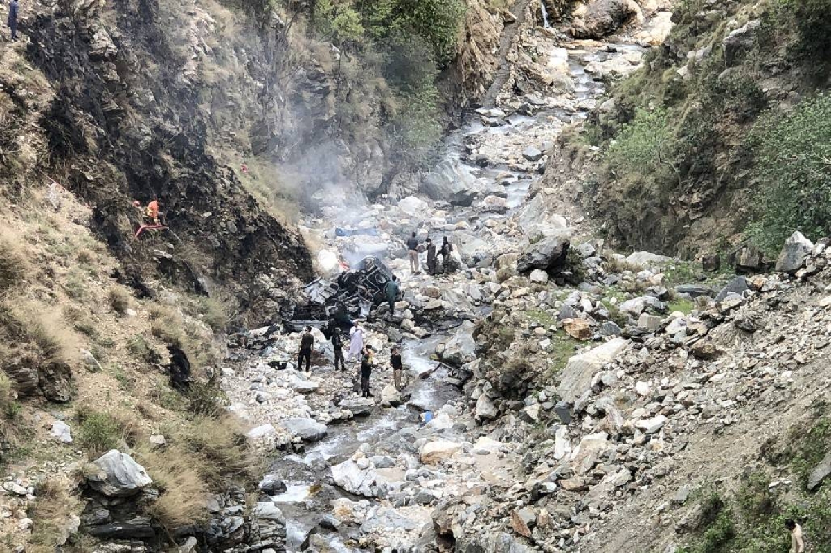 NO SURVIVORS Security officials inspect the wreckage of an attacked vehicle carrying Chinese dam workers that plunged into a ravine off the Karakoram Highway, near the city of Besham, Shangla district, Khyber Pakhtunkhwa province, northwestern Pakistan on Tuesday, March 26, 2024. AFP PHOTO