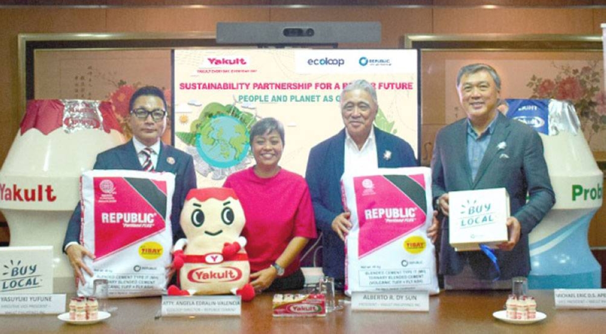 Yakult Philippines Inc. (YPI) signs a partnership with Republic Cement, aiming to divert qualified residual waste from landfills and waterways through coprocessing. It is one of the solutions of YPI to comply with and support the extended producer responsibility or EPR law in the Philippines. The photo shows (from left) Yasuyuki Yufune, executive vice president of YPI; Angela Edralin-Valencia, director of Ecoloop; Alberto Dy Sun, president of YPI; and Michael Eric Ong, vice president of YPI. CONTRIBUTED PHOTO