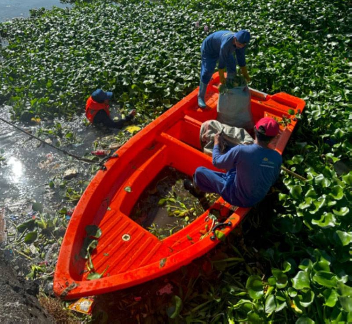 At the Malabon creek behind SM City Sucat in Parañaque, SM’s donated trash-boat is used for trash removal, which is a proactive step toward cleaner waterways. CONTRIBUTED PHOTO