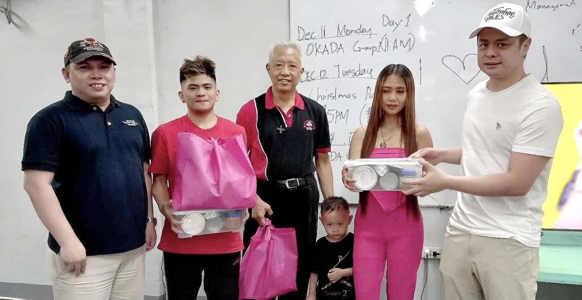 The photo shows Science Diplomat Glenn Banaguas (leftmost), Fr. Benigno Beltran (center) and Philippine Airlines President and Chief Operating Officer Stanley Ng (rightmost) handing donations to beneficiaries. CONTRIBUTED PHOTO