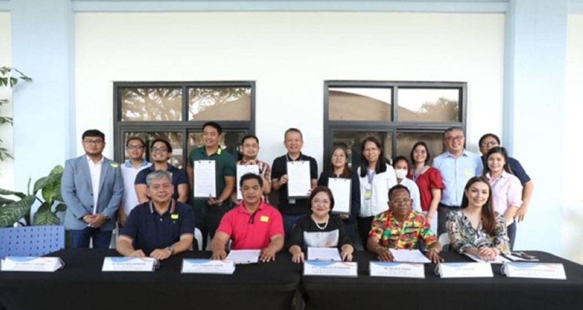 Led by Clark Development Corp. (CDC) President and Chief Executive Officer Agnes Devanadera (seated, 3rd from right), the signing of the joint management agreement between the government and the Ayta tribe involved representatives of the CDC, National Commission on Indigenous People, Ayta tribe, City of Mabalacat local government unit (LGU) and Bamban LGU technical working group. CONTRIBUTED PHOTO