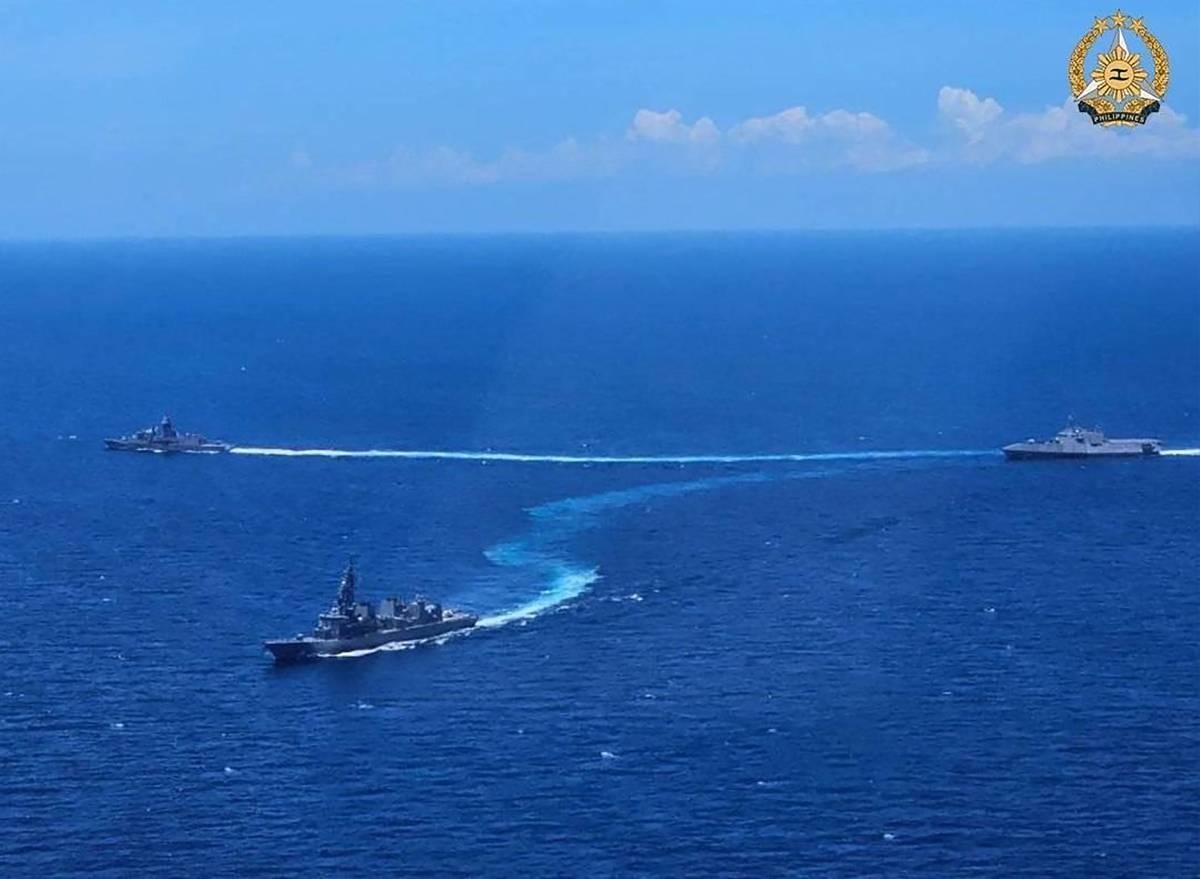 This handout photograph taken on April 7, 2024 and released by the Armed Forces of the Philippines (AFP), shows shows HMAS Warramunga, USS Mobile and JS Akebono maneuvering to form diamond formation during the first Multilateral Maritime Cooperative Activity between the Philippines, US, Australia and Japan, in South China Sea. AFP PHOTO /Armed Forces of the Philippines 