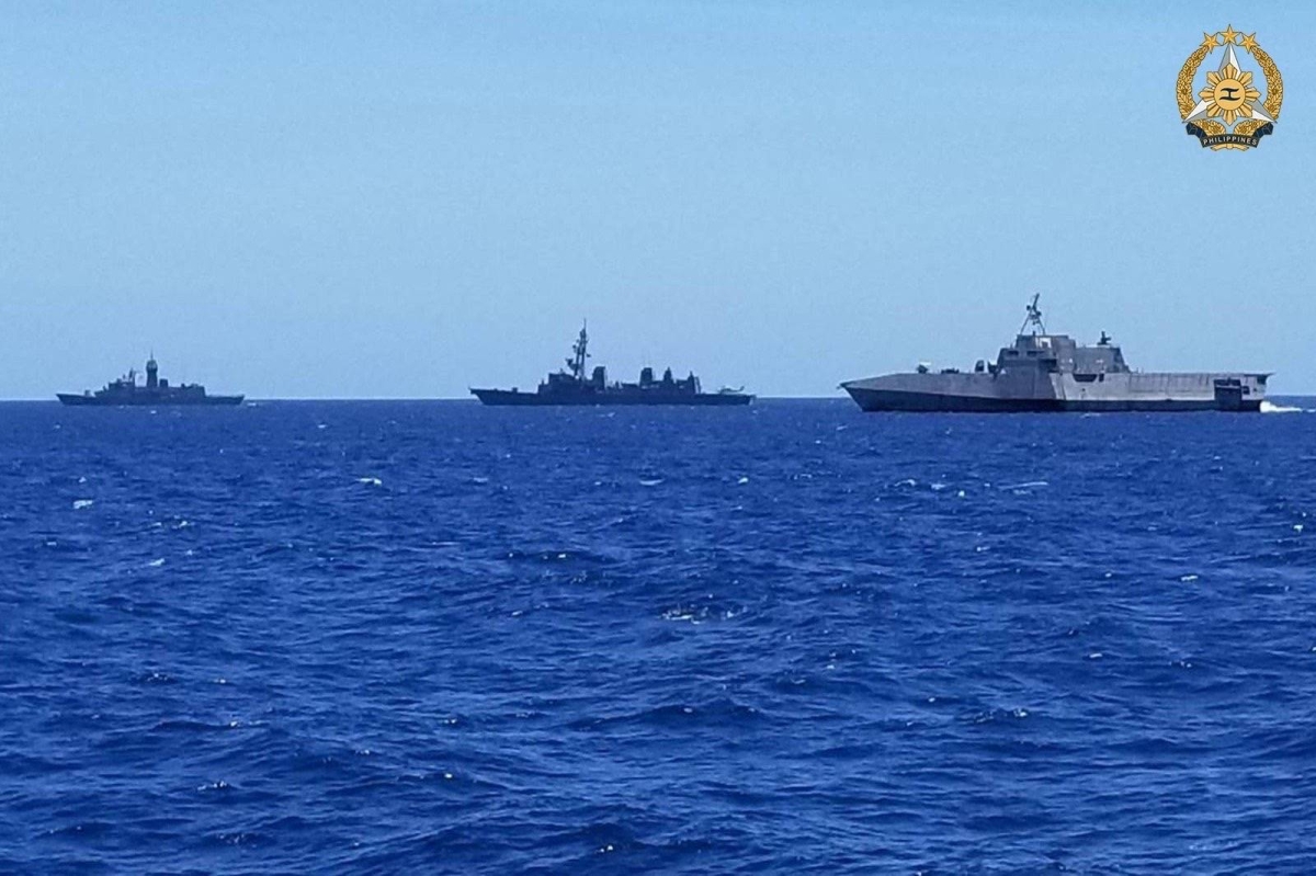 In this handout photo taken and received on April 7, 2024 from the Armed Forces of the Philippines (AFP), shows participating ships displaying their station-keeping skills with precision as they maneuver into different formations as part of the Division Tactics / Officer of the Watch maneuver during the first Multilateral Maritime Cooperative Activity between the Philippines, US, Australia and Japan, in South China Sea. AFP PHOTO / Armed Forces of the Philippines 